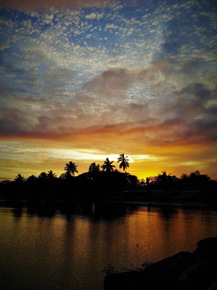 Fiji 's sun painted sky