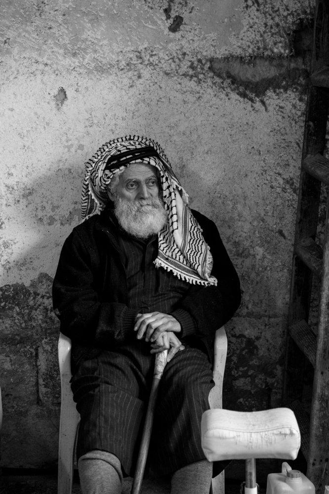 Eldery man in old store