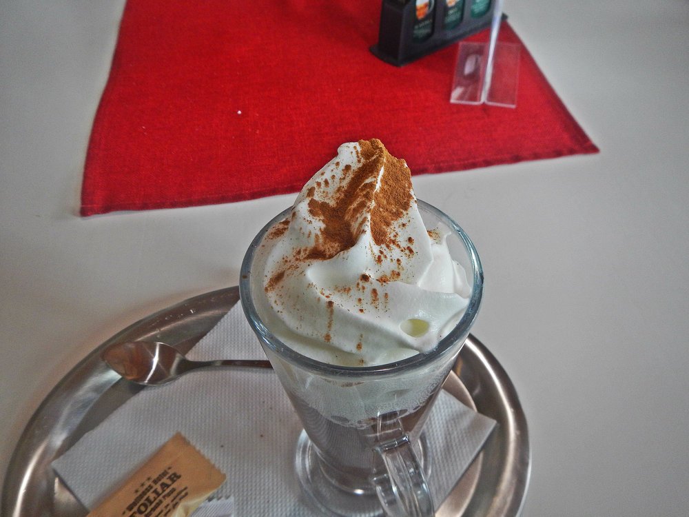 Hot chocolate with whipped cream and cinnamon.