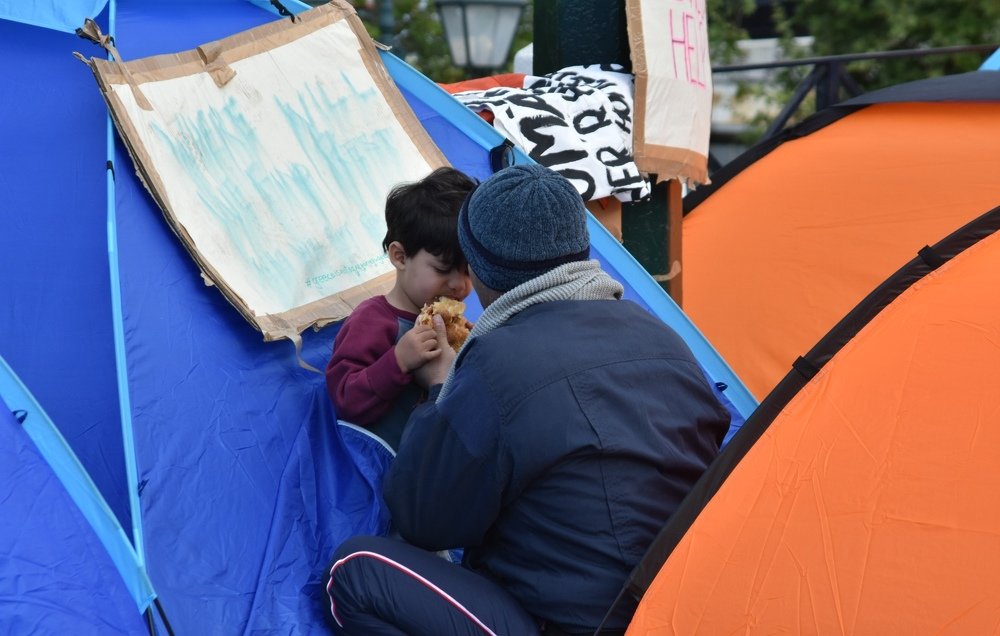 Refugees evicted from squat set up camp in Syntagma Athens Greece