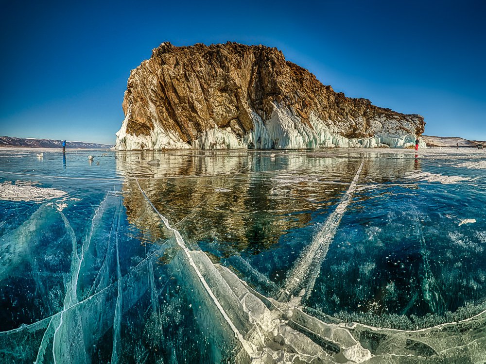 Isle rock in mirror ice of Baikal