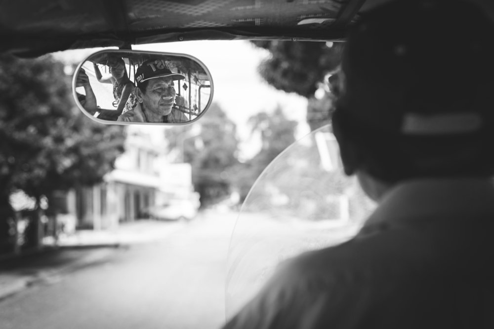 Reflect portrait of Taxi driver in Laos