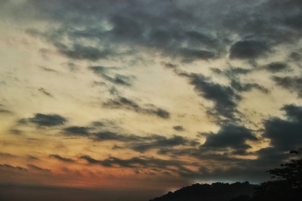 Sun behind the hill
