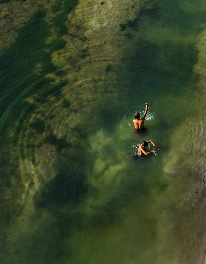 Children taking bath in the river water