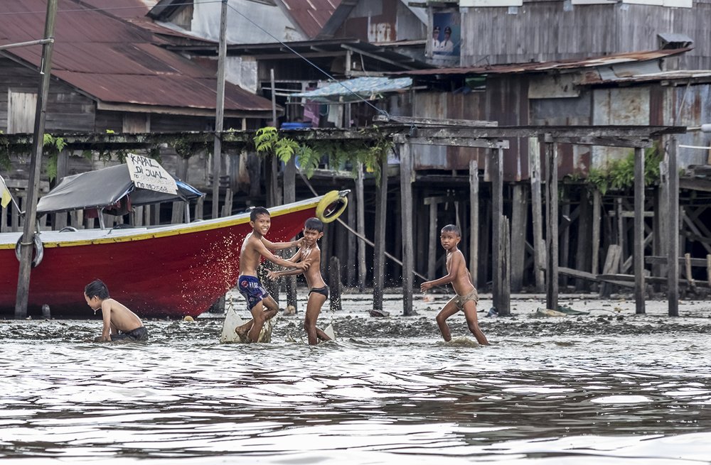 Playing on Mahakam River