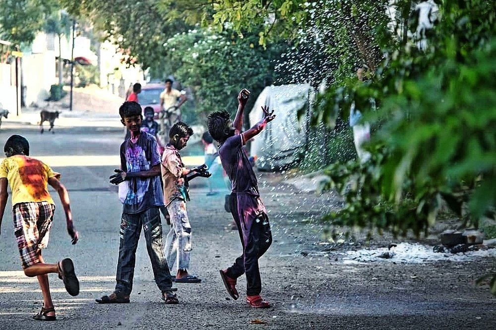 Playing Holi colors.