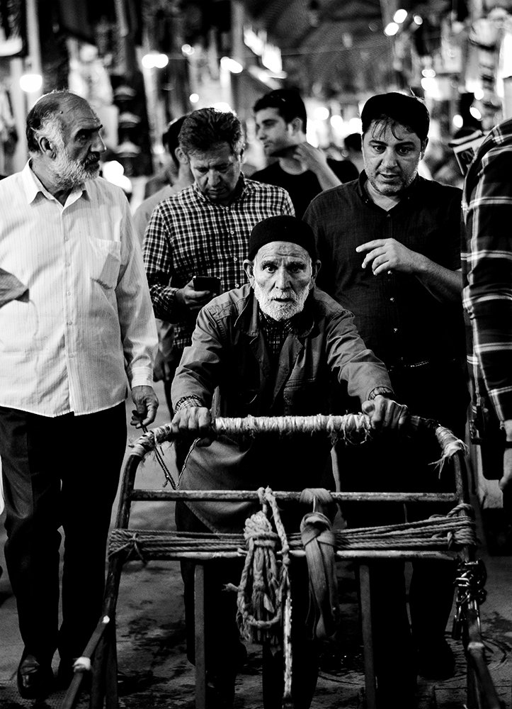 old worker with strong eyes