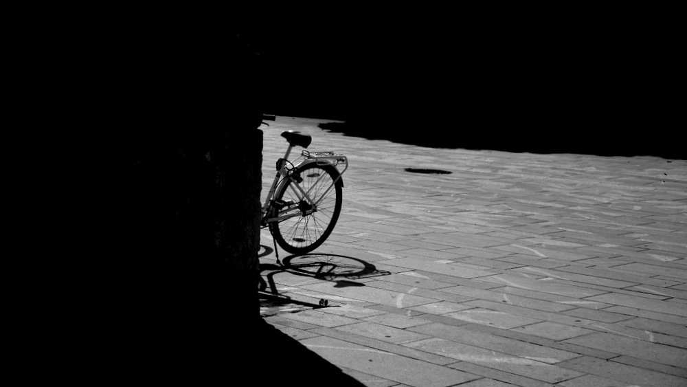 white bicycle  in the sun