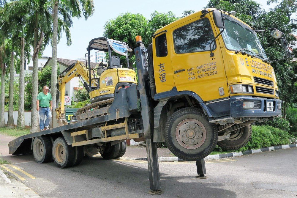 Unload Backhoe from Low Loader Truck