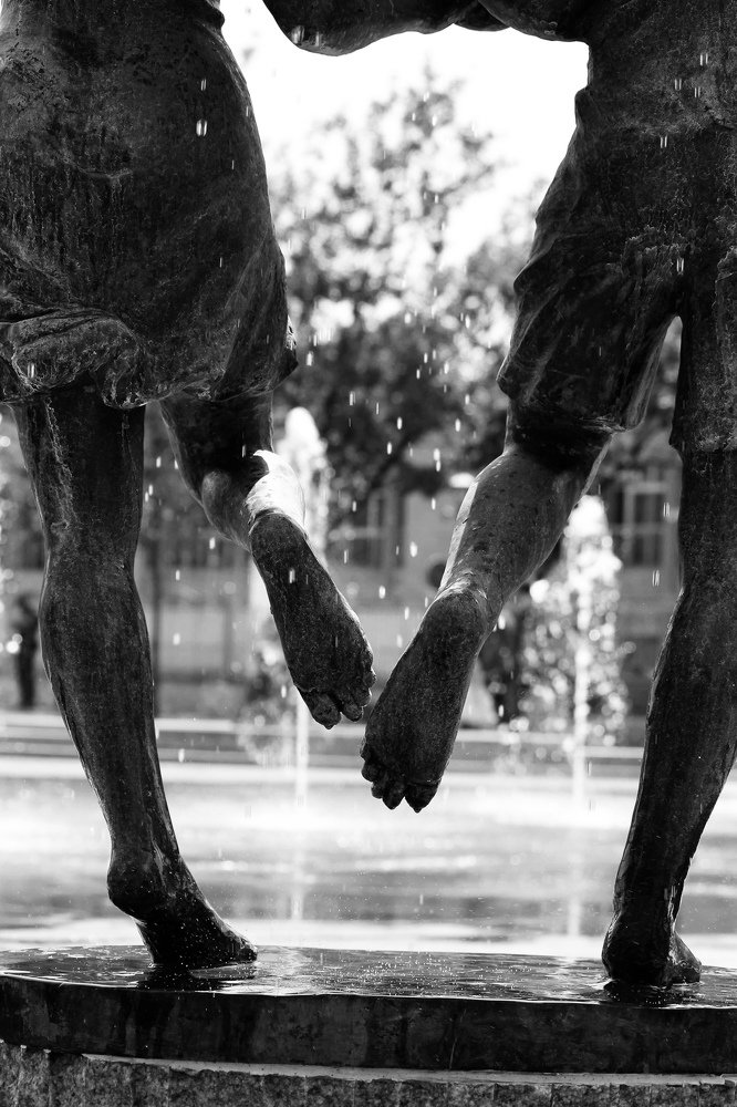 Statues running in the rain