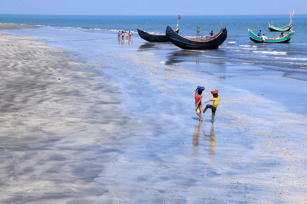 Two children playing on beach