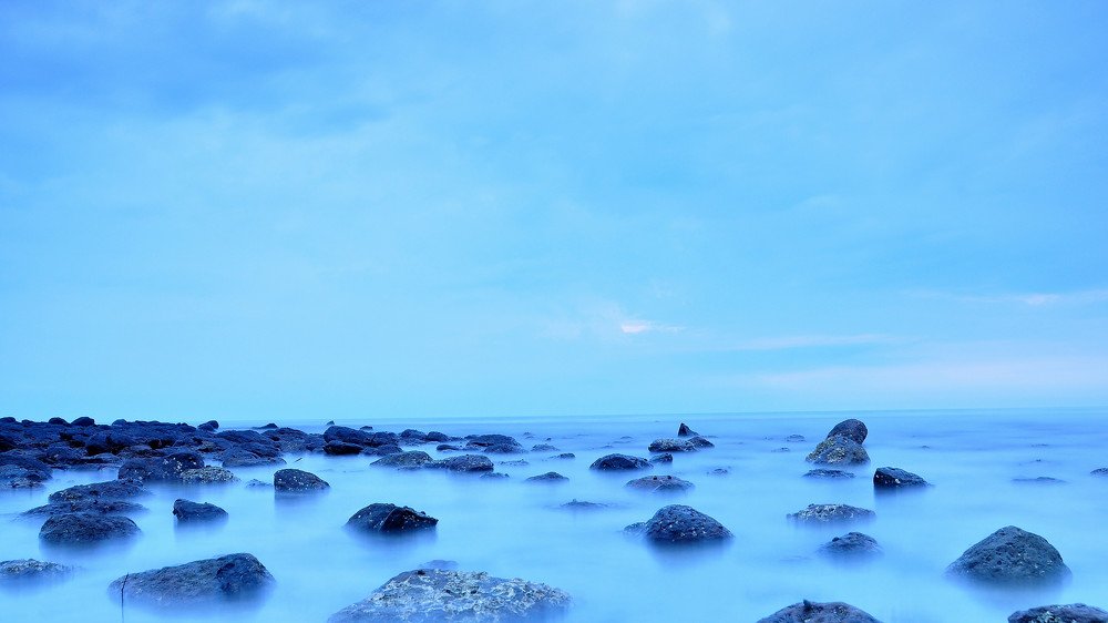Sunrise photo at a rocky seaside