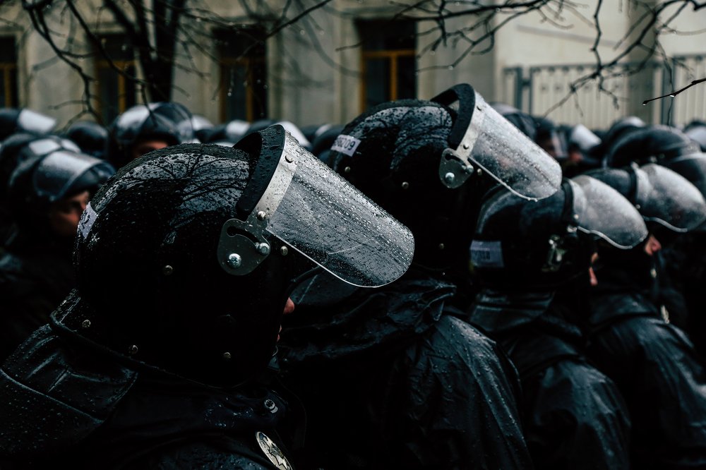 A police helmet on which drops from the rain.