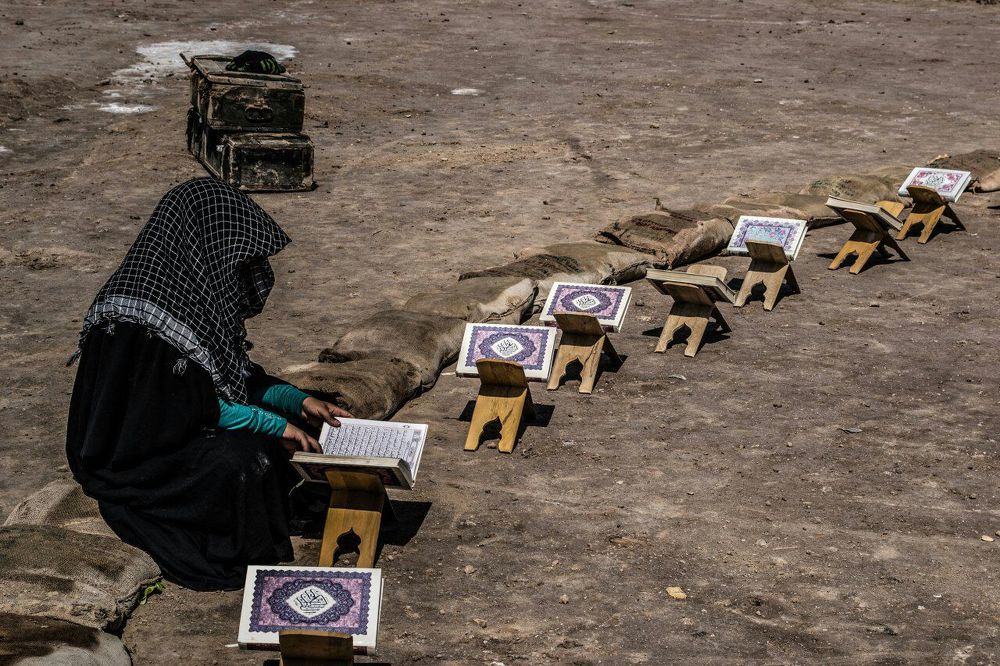 The girl is study Quran