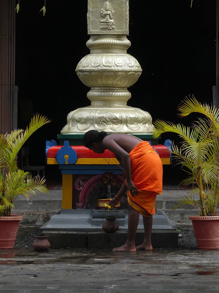 Tamil priest worshipping God.