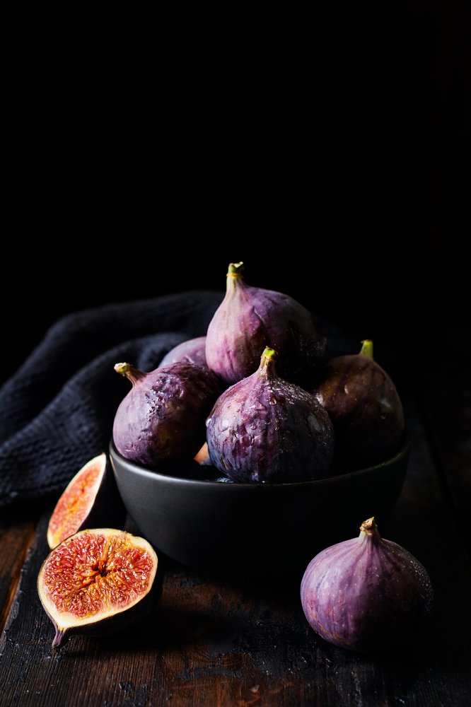 Fresh figs on dark old  wooden background.