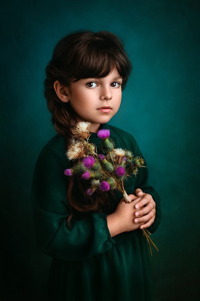 Girl with thistle flowers