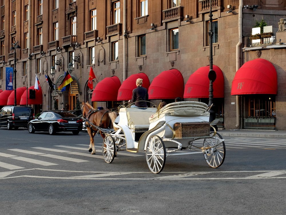 По городу в белом ландо