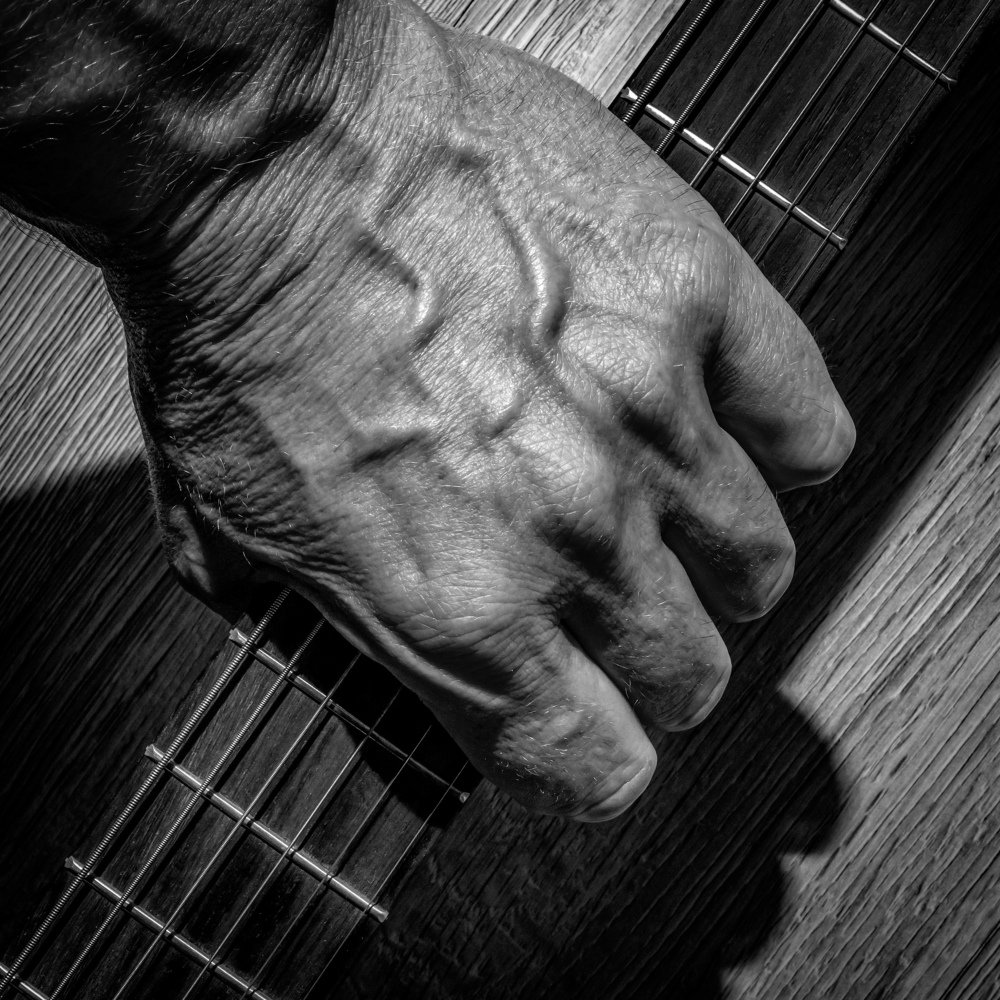 Acoustic guitar in the hands of a rock musician.