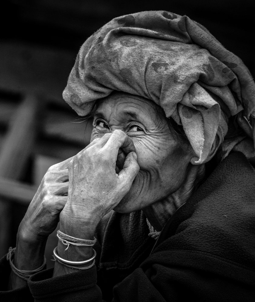 A village woman from thailand behind the happy expression for my camera