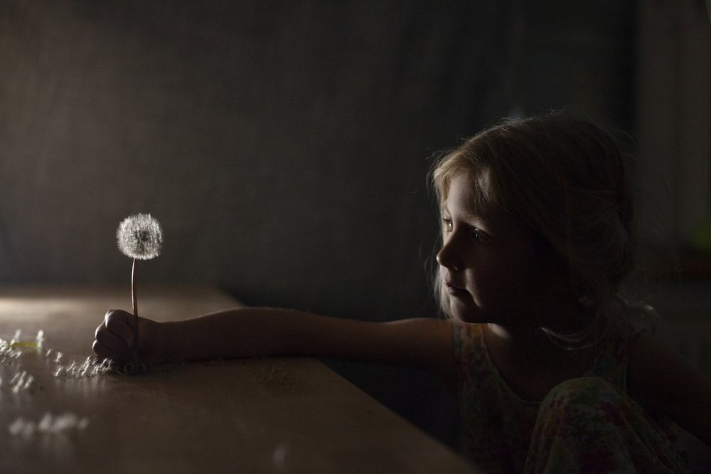 Girl and dandelion
