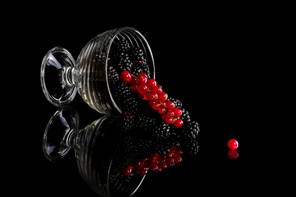 Glass with blackberries and currants