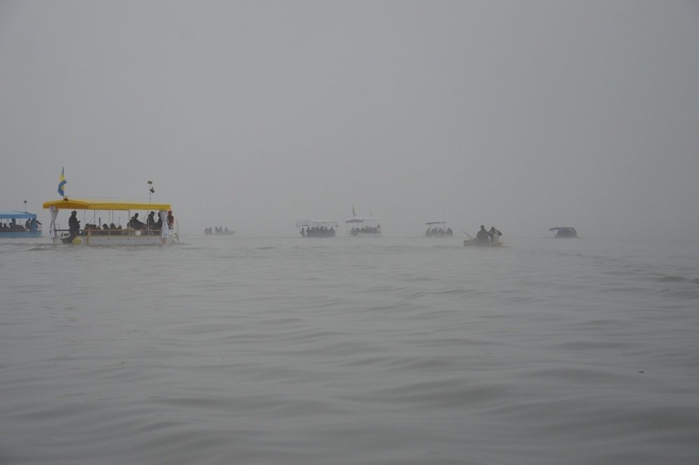 Moving fishermen to boats on the other side of the lake.