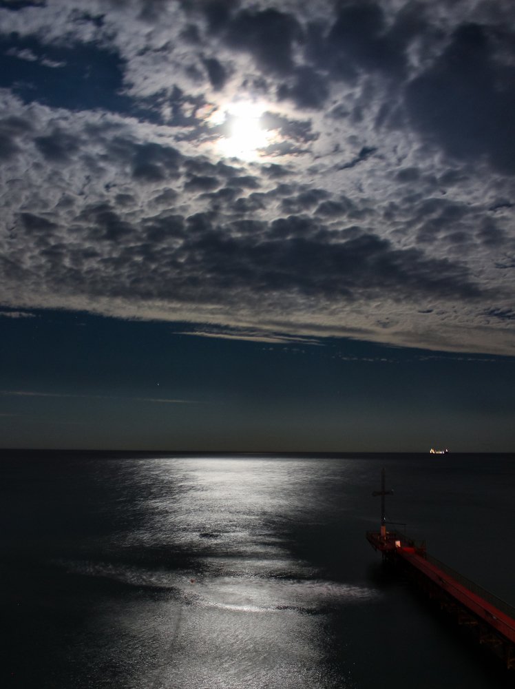 Peeking from behind the clouds