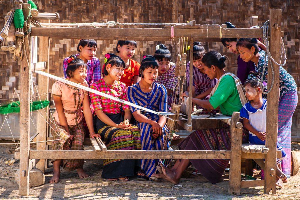 Woman weaving on a loom