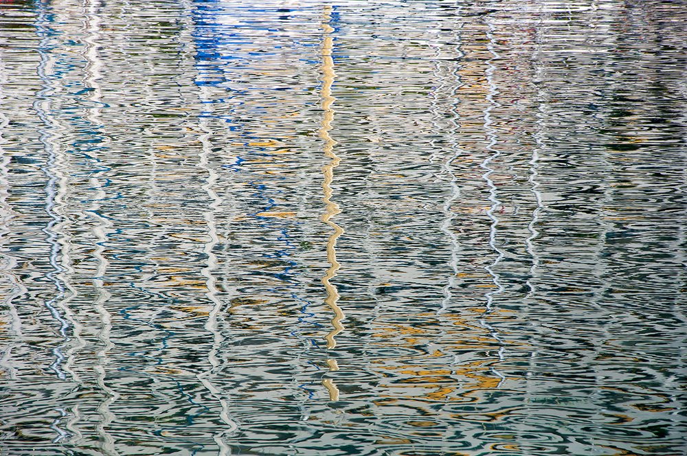 Masts reflection in the sea.