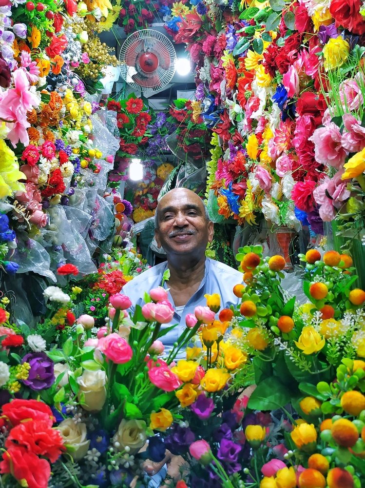 Between the artificial flowers