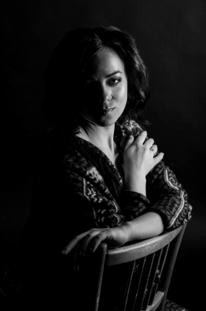 Julia portrait in black room.