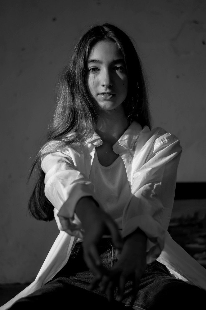 Portrait in grey room.