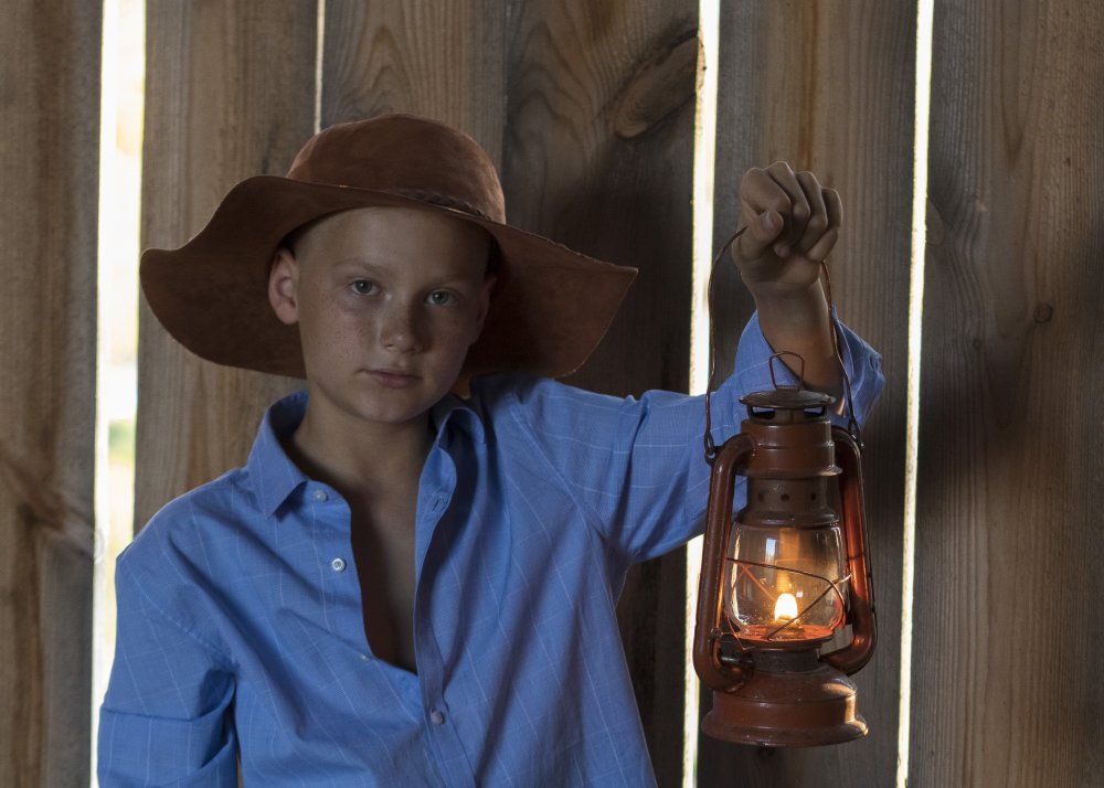 A boy with a headlamp