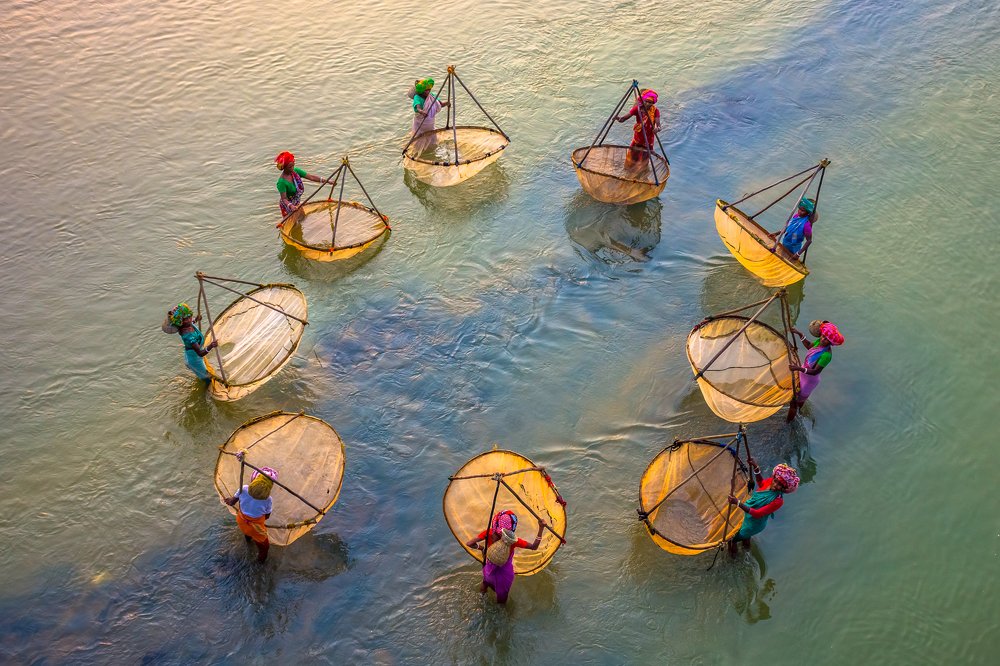 Fisher Women Catching Fishes