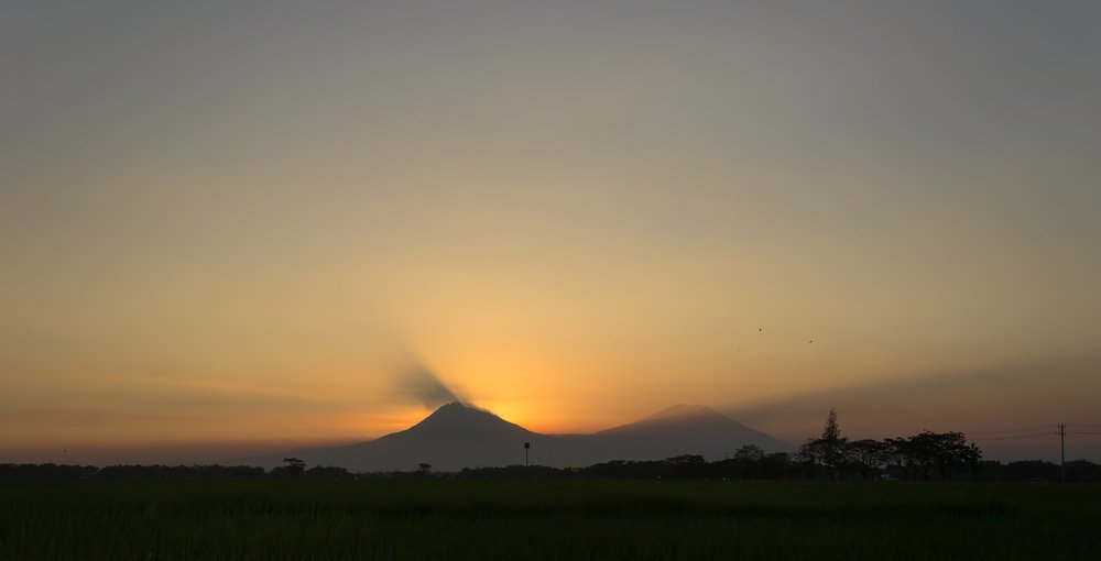 Sunset at Mount Merapi and Mount Merbabu.