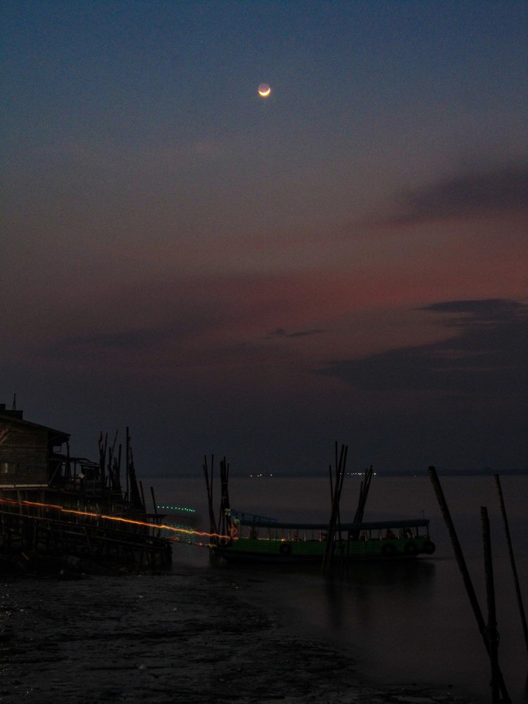 Crossing the river after sunset