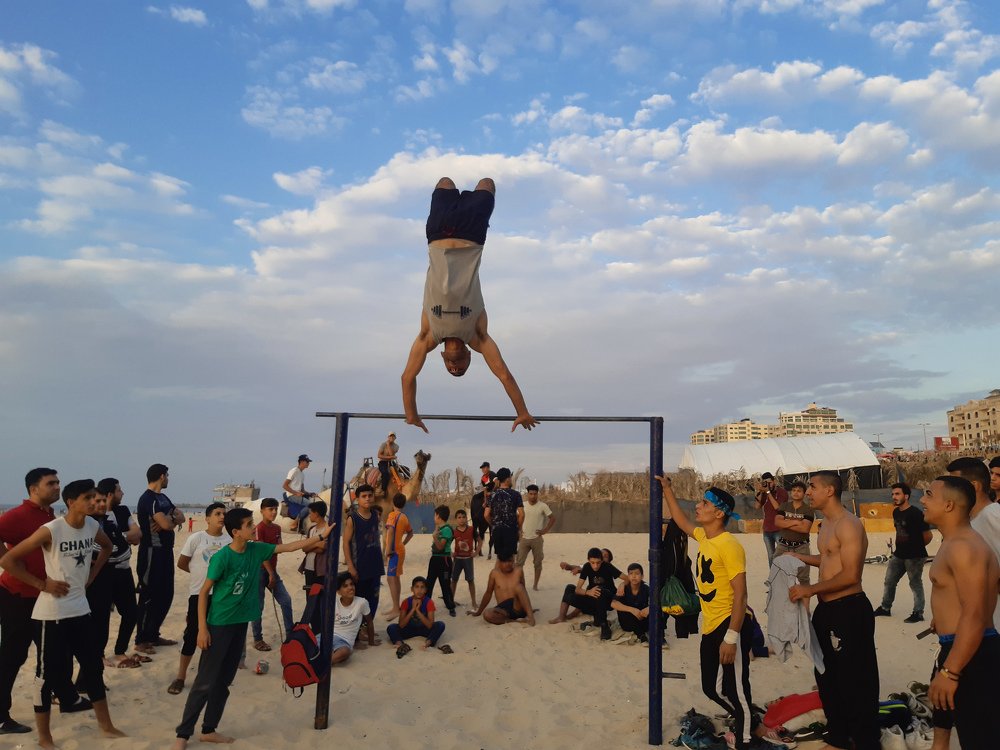 Young people in the Gaza Strip practice gymnastics on the beach, as they are the only outlet in light of the siege imposed by the Israeli occupation.
