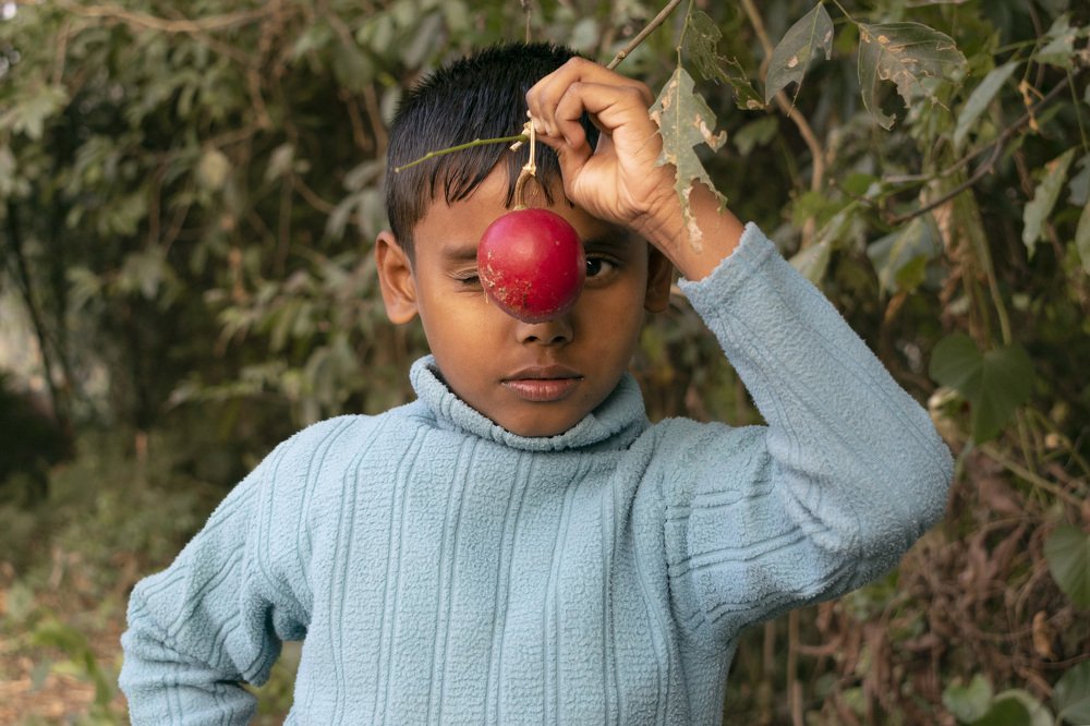 A child with a fruit