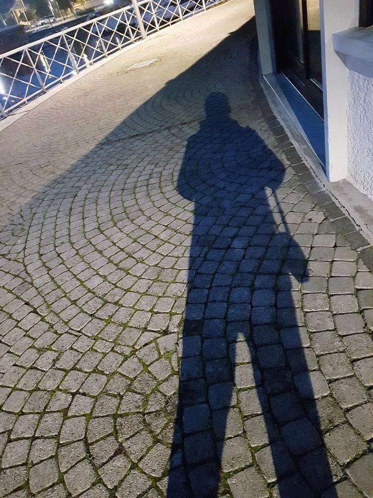 Cobblestones and shadow in harbour