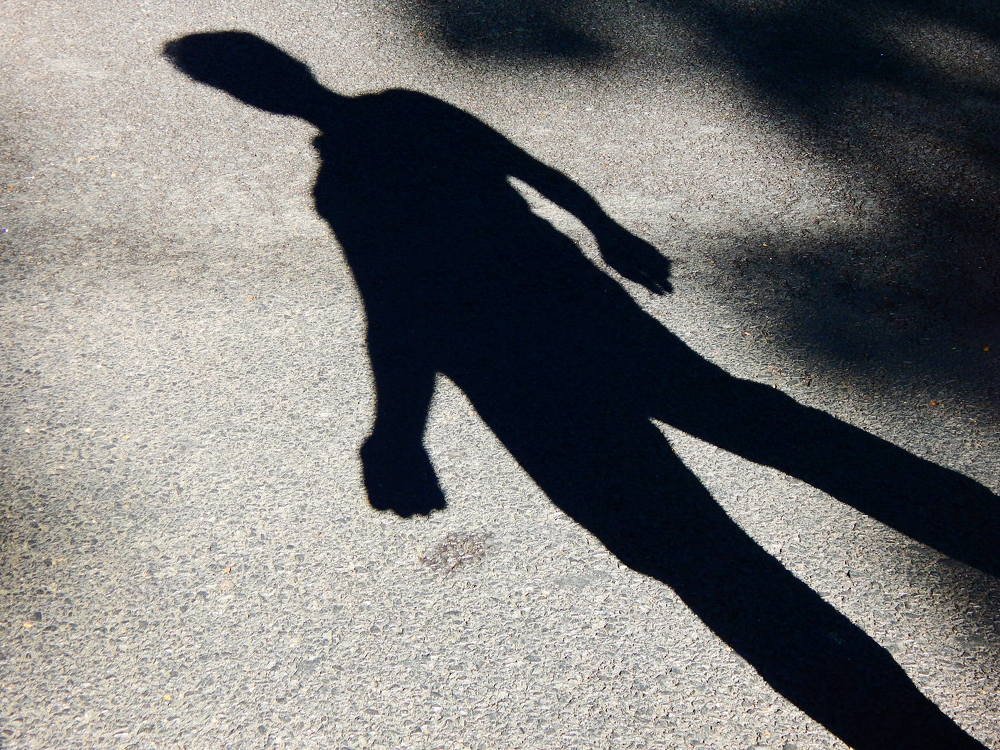 Shadow of a man on lonely street