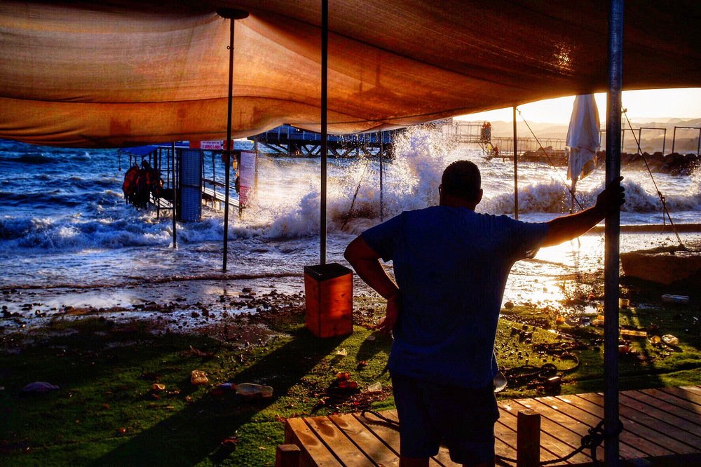 A man watching the storm on the Red Sea