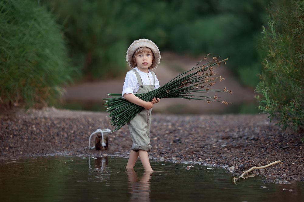 За тростником