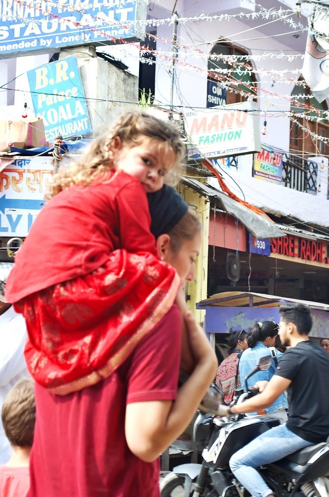 Mother and her baby on shoulder