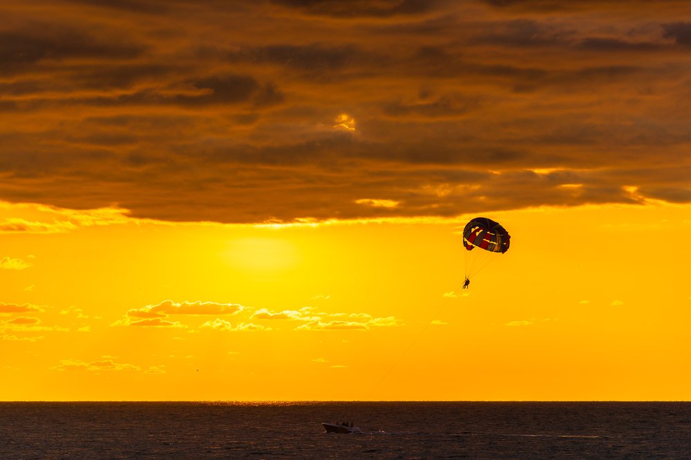 Flying baloon over the Black Sea at sunset time.
