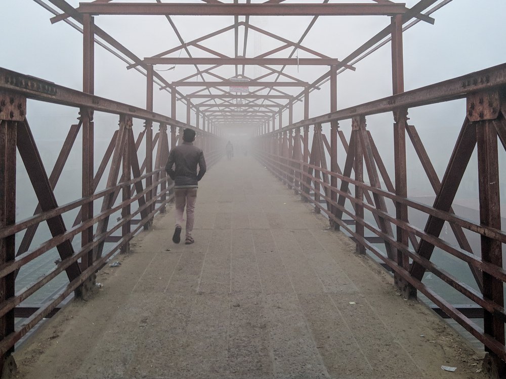 A lonely walk  through fog