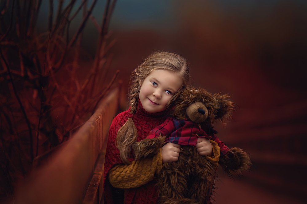 Girl with a teddy bear.