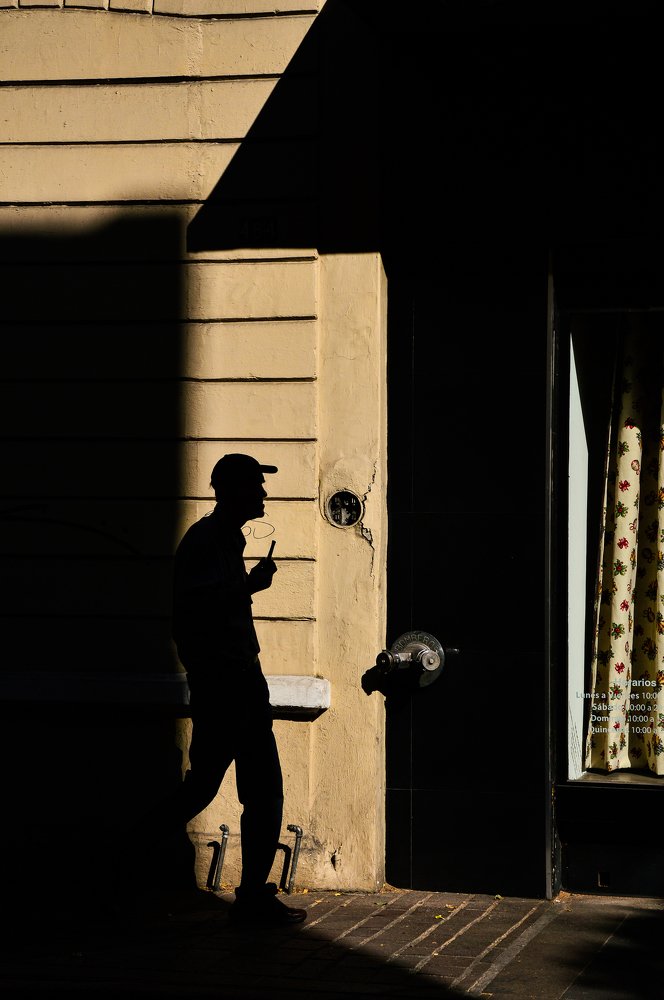 Shadows of man and his pipe