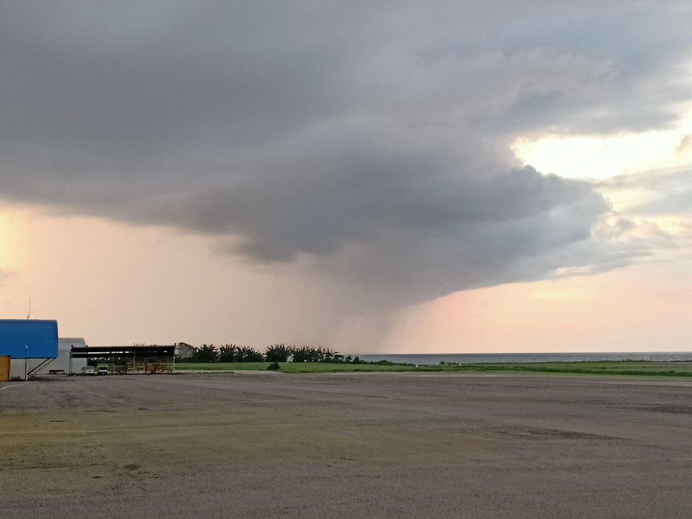 Beautiful sunset at the Dili airport with the approaching weather