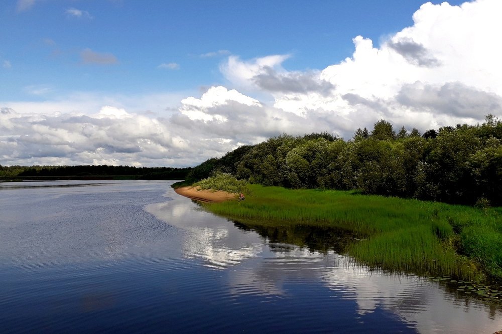 На реке.